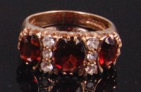 Lot 510 - A modern 9ct gold garnet and white sapphire...
