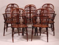 Lot 786 - A harlequin set of eight elm and yew Windsor...