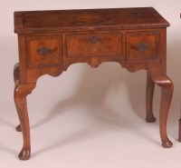 Lot 791 - A walnut and figured walnut lowboy, in the...