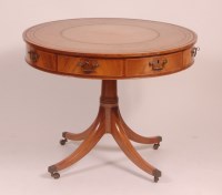 Lot 795 - A mahogany drum table, in the Regency style,...