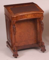 Lot 797 - A Victorian figured walnut kneehole writing...