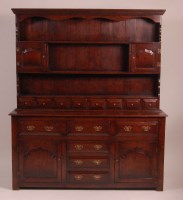 Lot 812 - An 18th century style oak dresser, the upper...