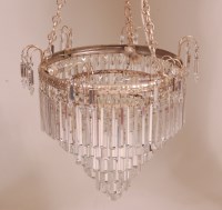 Lot 819 - A cut crystal glass chandelier, of circular...