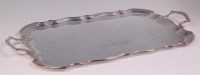 Lot 464 - A silver twin handled drinks tray, having a...