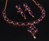Lot 569 - An 18ct gold amethyst and diamond necklet with...