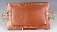 Lot 35 - An Art Nouveau copper and brass twin handled...