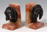 Lot 2 - A pair of Art Deco spelter and marble dog...