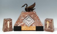 Lot 4 - An Art Deco variegated marble three piece...
