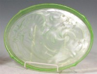 Lot 10 - A French Art Deco moulded and tinted green...