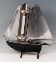 Lot 57 - A mid-20th century part black enamelled metal...