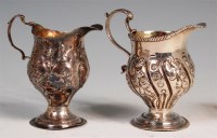 Lot 110 - A George III helmet form cream jug, with leaf...