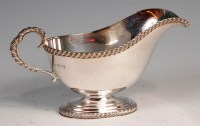 Lot 114 - A Georgian style silver pedestal sauceboat,...