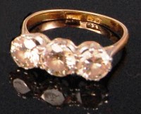 Lot 237 - A ladies 18ct gold and platinum diamond three...