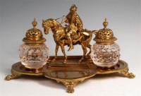 Lot 263 - A circa 1900 French gilt brass encrier, having...