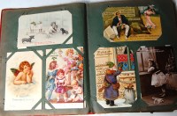 Lot 523 - Greetings cards - two albums to include;...