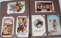 Lot 524 - Greetings cards - two albums to include;...