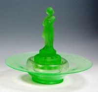 Lot 7 - A mid 20th century French green tinted glass...