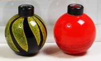 Lot 91 - A matched pair of French heavy art glass squat...