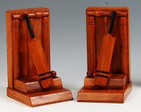 Lot 114 - A pair of Art Deco oak cricket related...