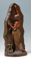 Lot 144 - A French Art Nouveau patinated bronzed...