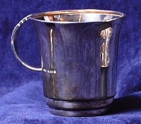 Lot 182 - An Art Deco silver single handled christening...