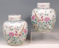 Lot 807 - A pair of Chinese famille rose jars and covers,...