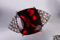 Lot 218 - A contemporary 18ct white gold, garnet and...