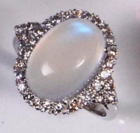 Lot 219 - A contemporary 18ct gold moonstone and diamond...