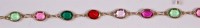 Lot 223 - An 18ct gold multi-gem set necklace, each...