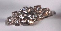 Lot 242 - An 18ct white gold diamond solitaire ring, the...