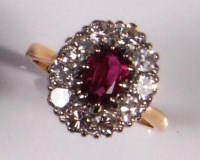 Lot 246 - An 18ct gold ladies ruby and diamond cluster...