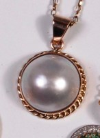 Lot 260 - A yellow gold pearl set pendant, dia.19mm, on...