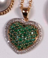 Lot 261 - A contemporary 9ct gold, emerald and diamond...