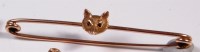 Lot 265 - A 9ct gold safety pin brooch, set with a foxes...