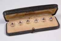 Lot 277 - A cased set of six crystal and sapphire set...