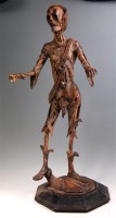 Lot 300 - A carved fruitwood memento mori figure, as a...
