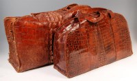 Lot 351 - An early 20th century crocodile skin Gladstone...