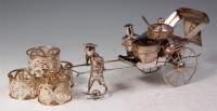 Lot 390 - A leather cased Chinese white metal rickshaw...