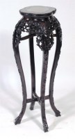 Lot 399 - An early 20th century Chinese carved hardwood...