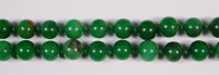 Lot 404 - A Chinese beaded and knotted jade necklace,...