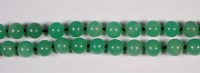 Lot 405 - A Chinese beaded and knotted celadon jade...