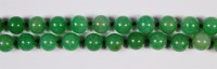 Lot 408 - A Chinese beaded and knotted jade necklace,...