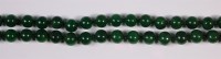 Lot 409 - A Chinese beaded and knotted jade necklace,...