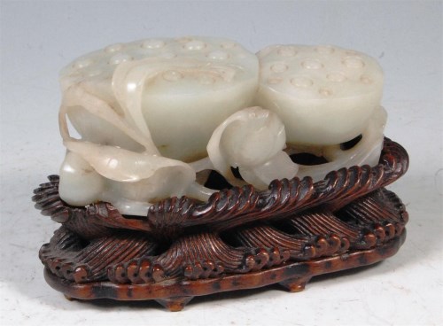 Lot 417 - A Chinese celadon jade carving of a cluster of...