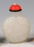 Lot 419 - A Chinese celadon jade snuff bottle, carved in...