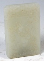 Lot 421 - A Chinese jade pendant, of rounded rectangular...