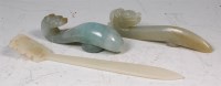 Lot 426 - Three Chinese carved jade belt hooks, to...