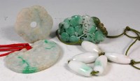 Lot 428 - Three Chinese carved jade discs, one with...