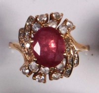 Lot 244 - A contemporary 9ct gold, ruby and white...