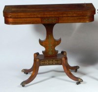 Lot 562 - A Regency rosewood and brass inlaid pedestal...